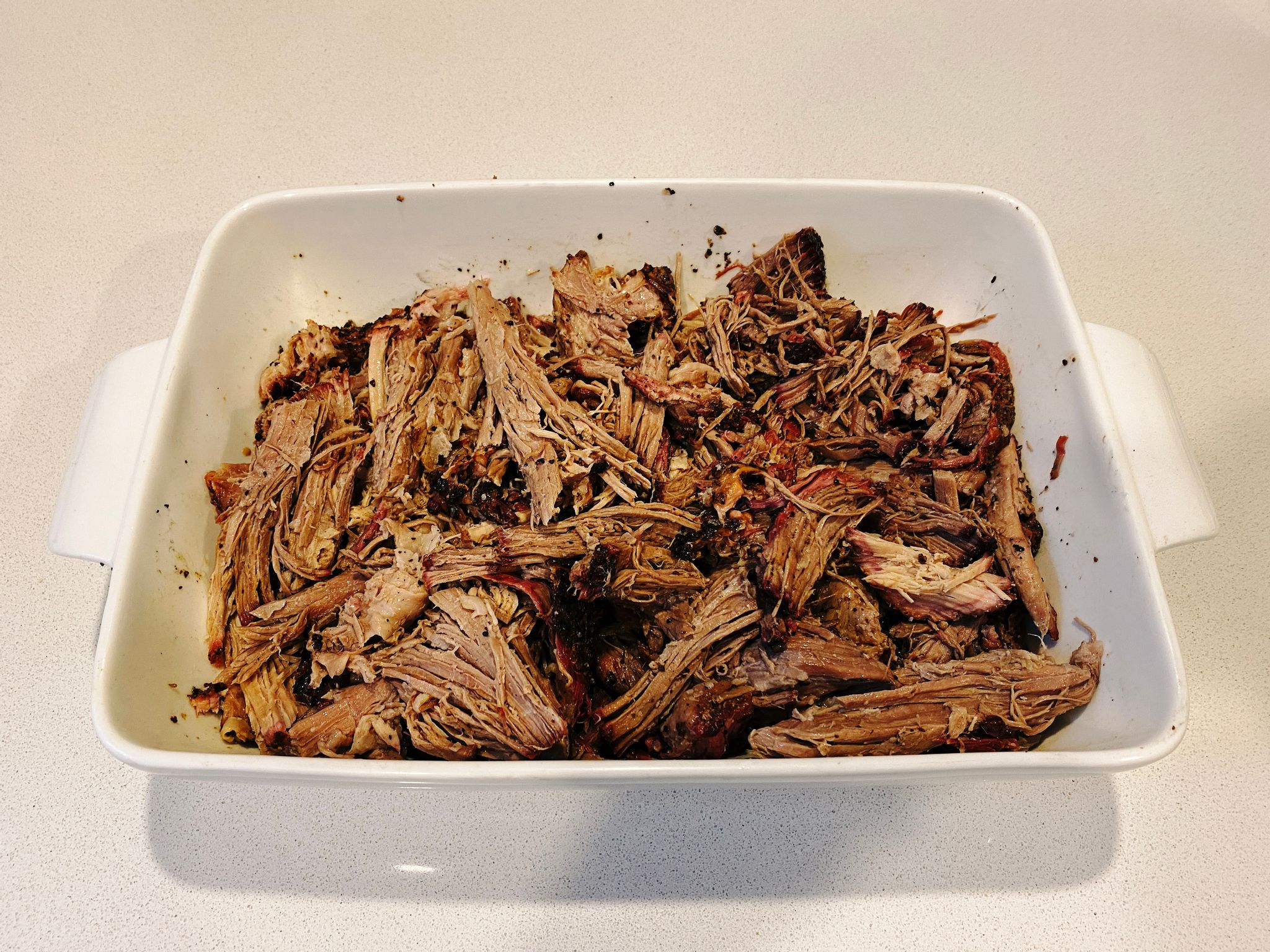 A photo of the fully-pulled pulled pork, all mixed up.