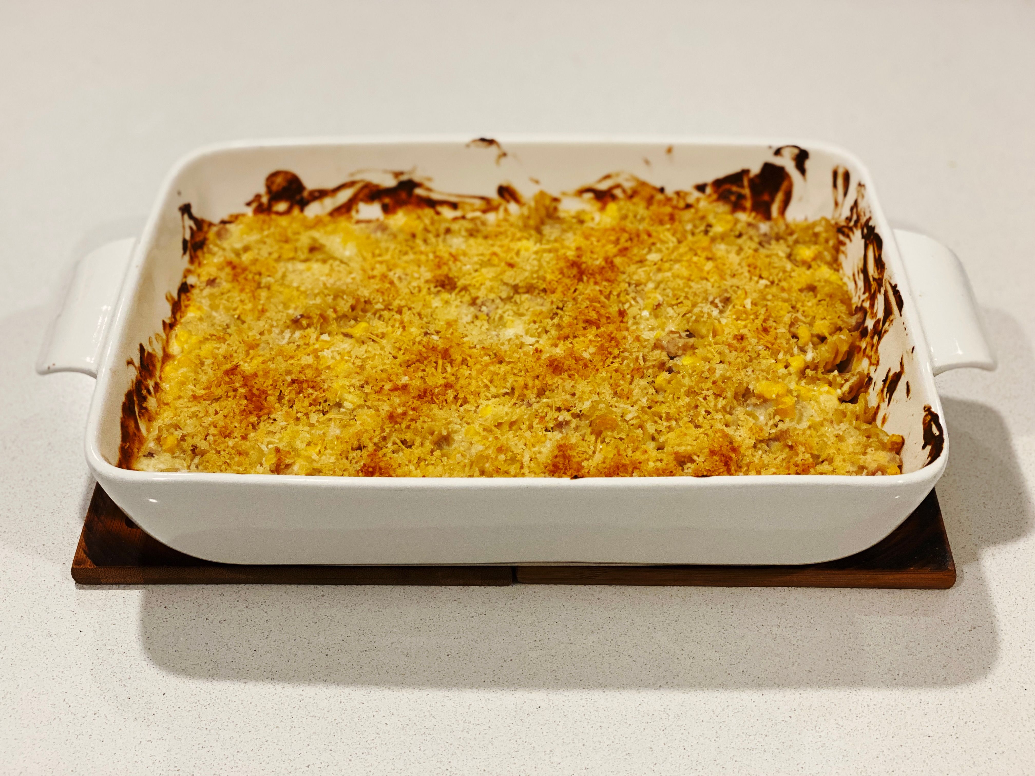 A photo of a white rectangular casserole dish with tuna mornay in it The top is covered in Panko breadcrumbs that have gone all golden and crispy and it looks amazing. (And it tasted amazing too.)