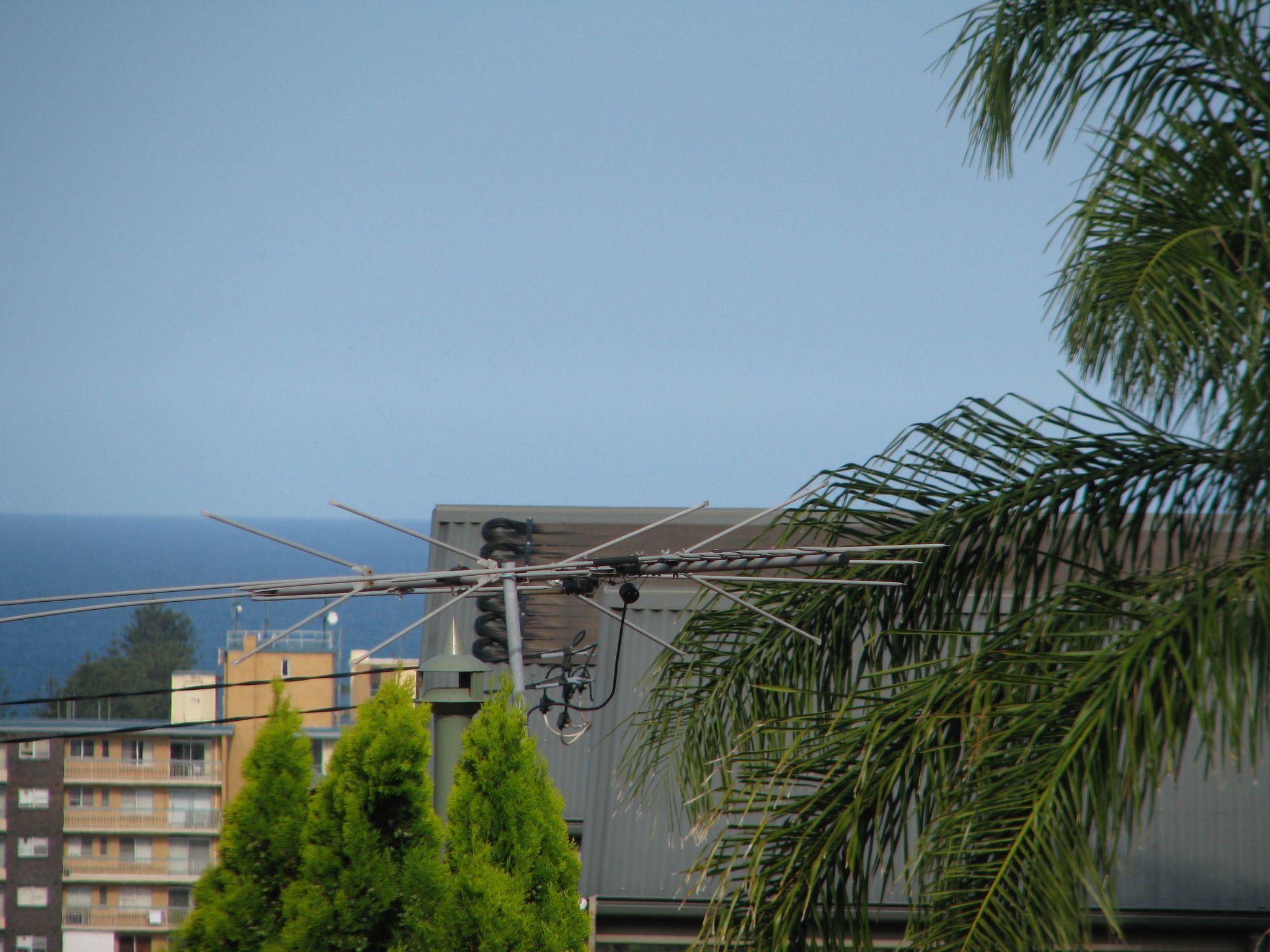 A very zoomed-in version of the previous photo, showing a TV antenna that was barely visible before.