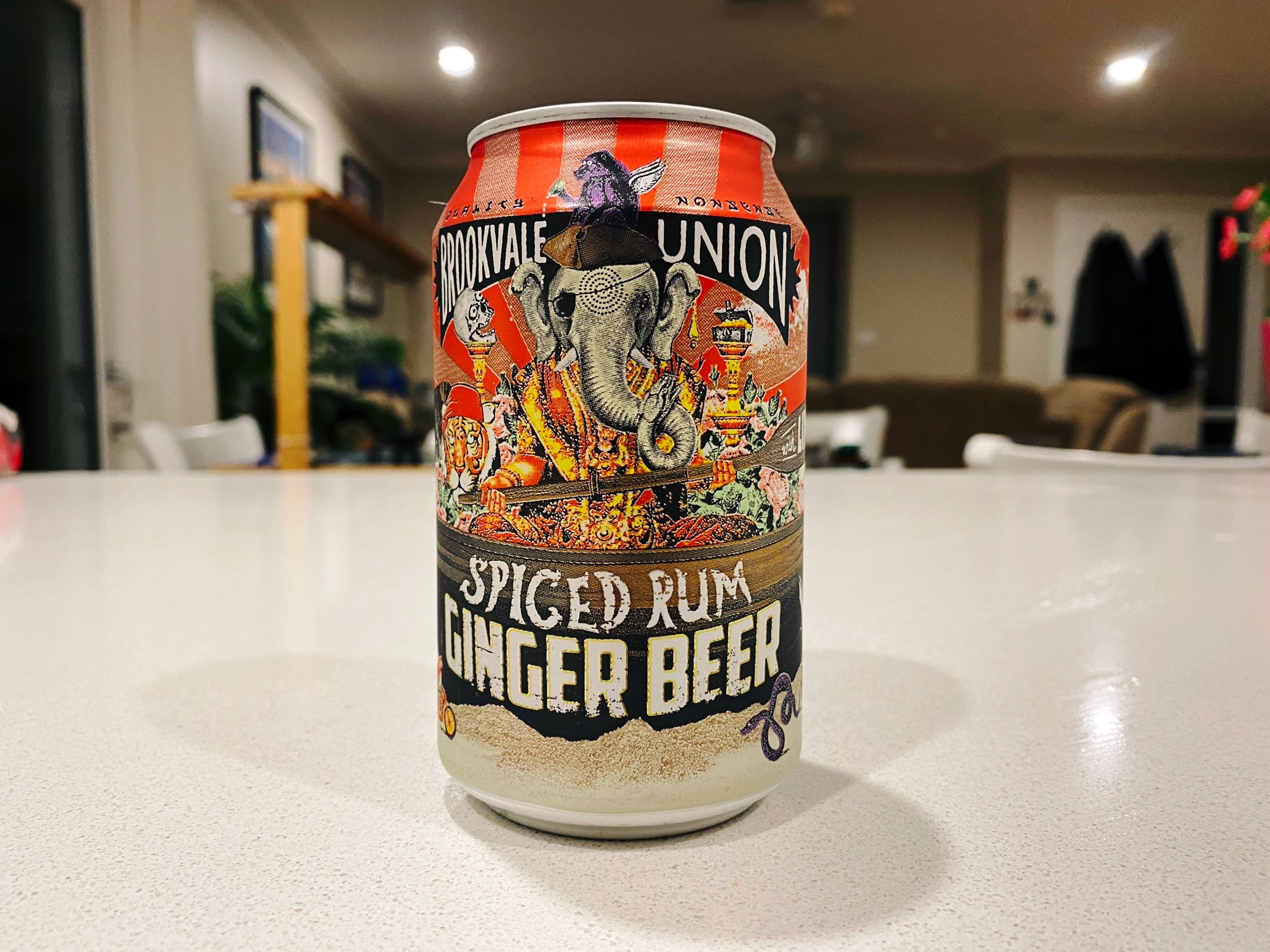 A photo of a can of Brookvale Union's spiced ginger beer. The art on the front has an elephant sitting down, wearing a Thai-looking decorative robe, but it also has an eyepatch and a pirate hat and is wielding a large sceptre.
