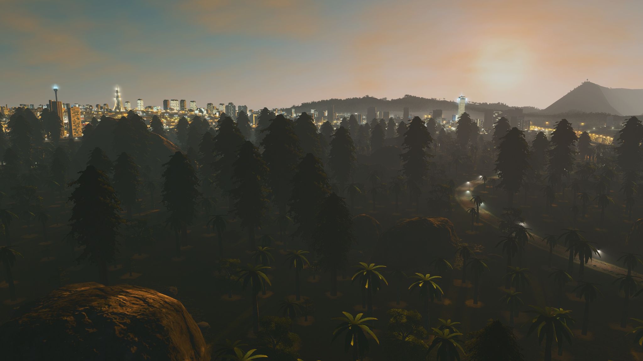 A screenshot from the game Cities: Skylines, the sun is just above the horizon, in the foreground is a forest of giant redwood trees partially covered in mist, and modern buildings are just visible over the tops of the trees.