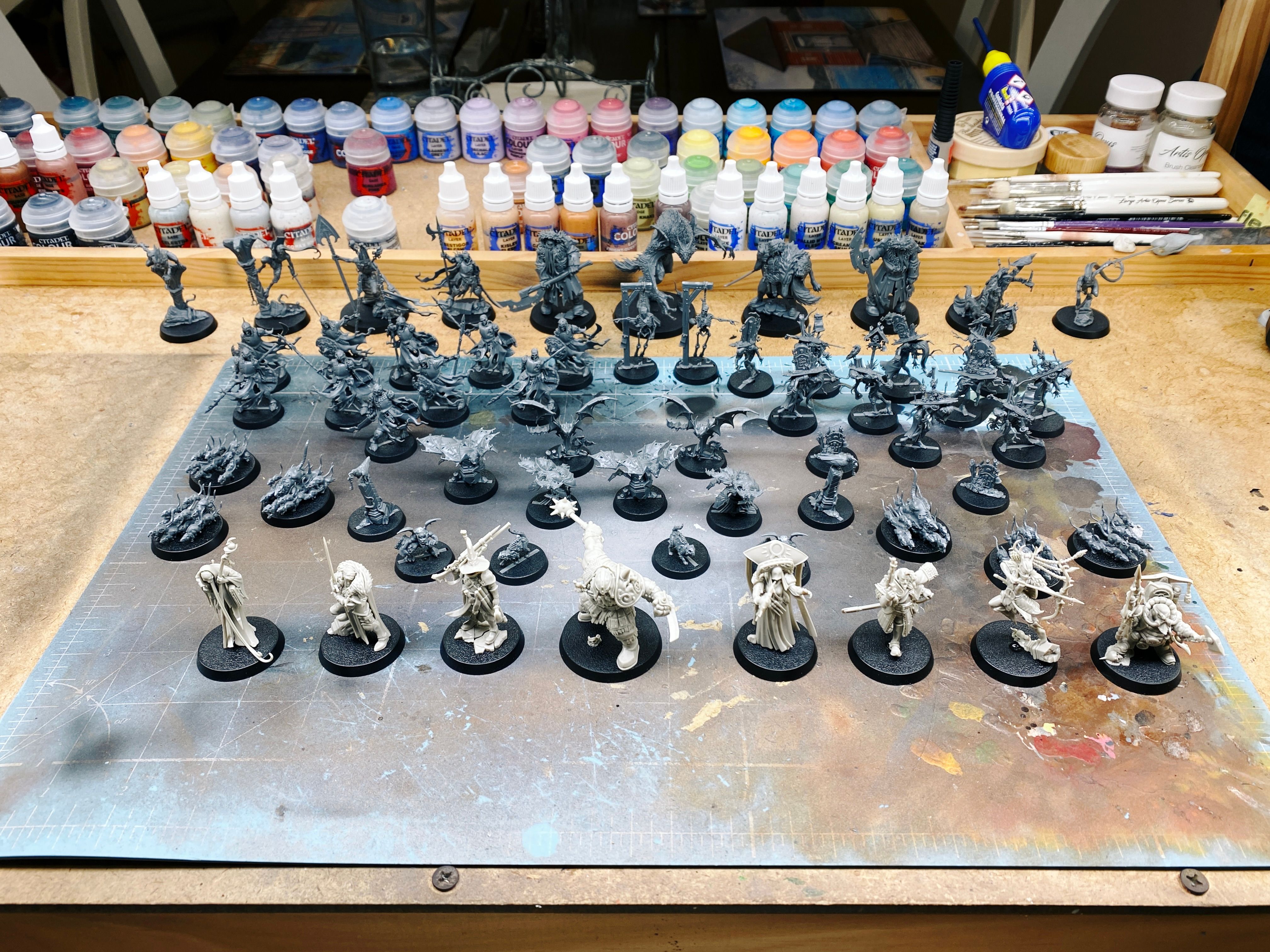 A photo of all sixty assembled but unpainted Warhammer Quest miniatures sitting on my painting table. See the previous posts in this thread for individual descriptions.