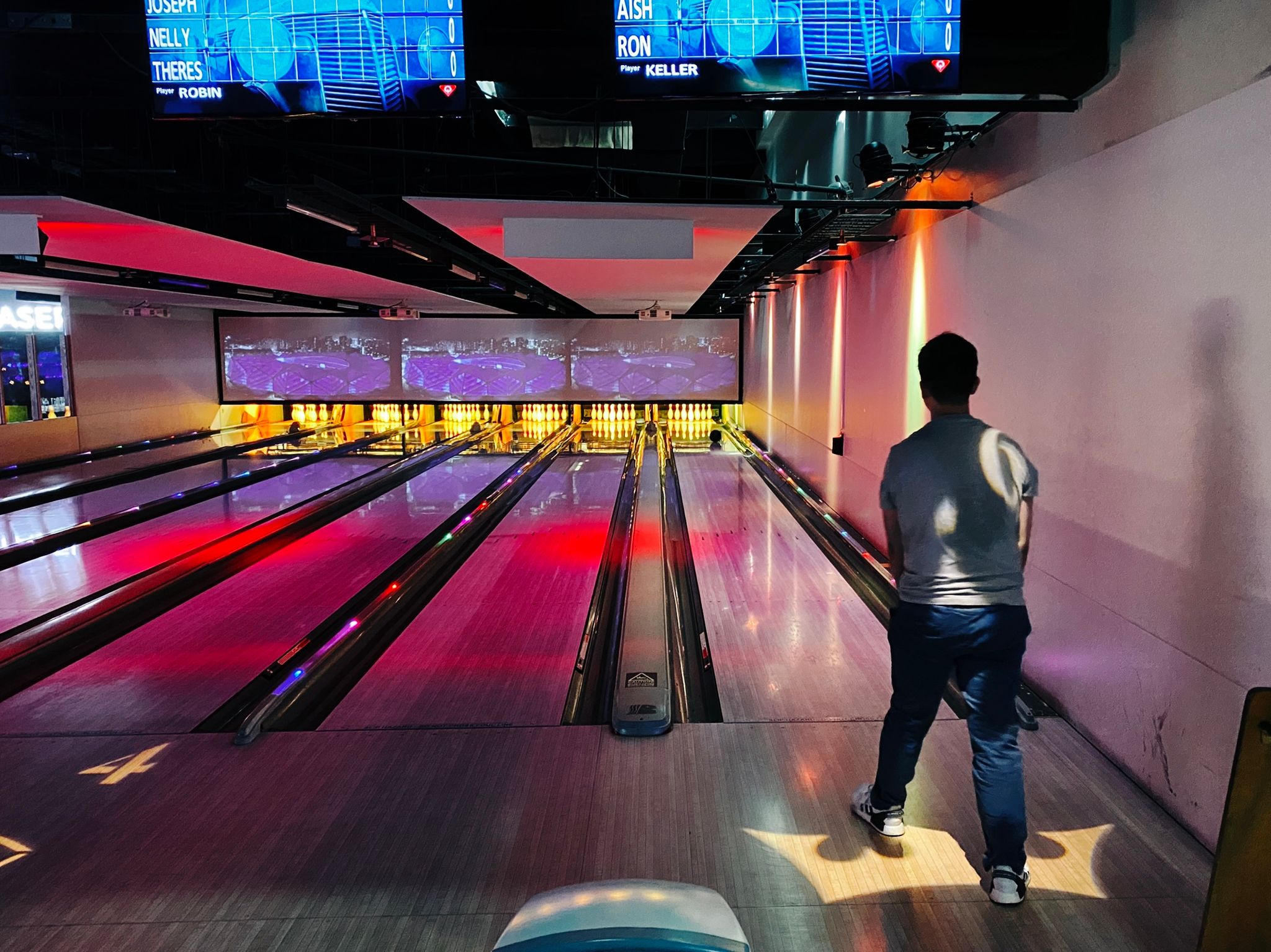 A photo of a neon-lot bowling alley.