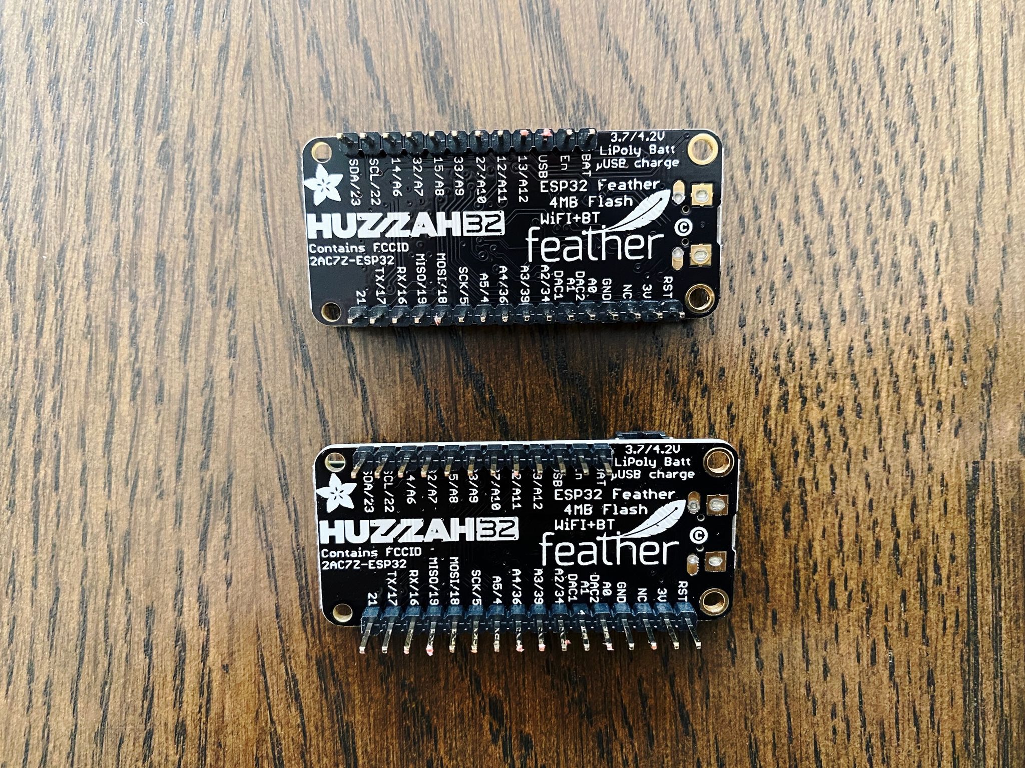 A photo of two small circuit boards with various chips on them.