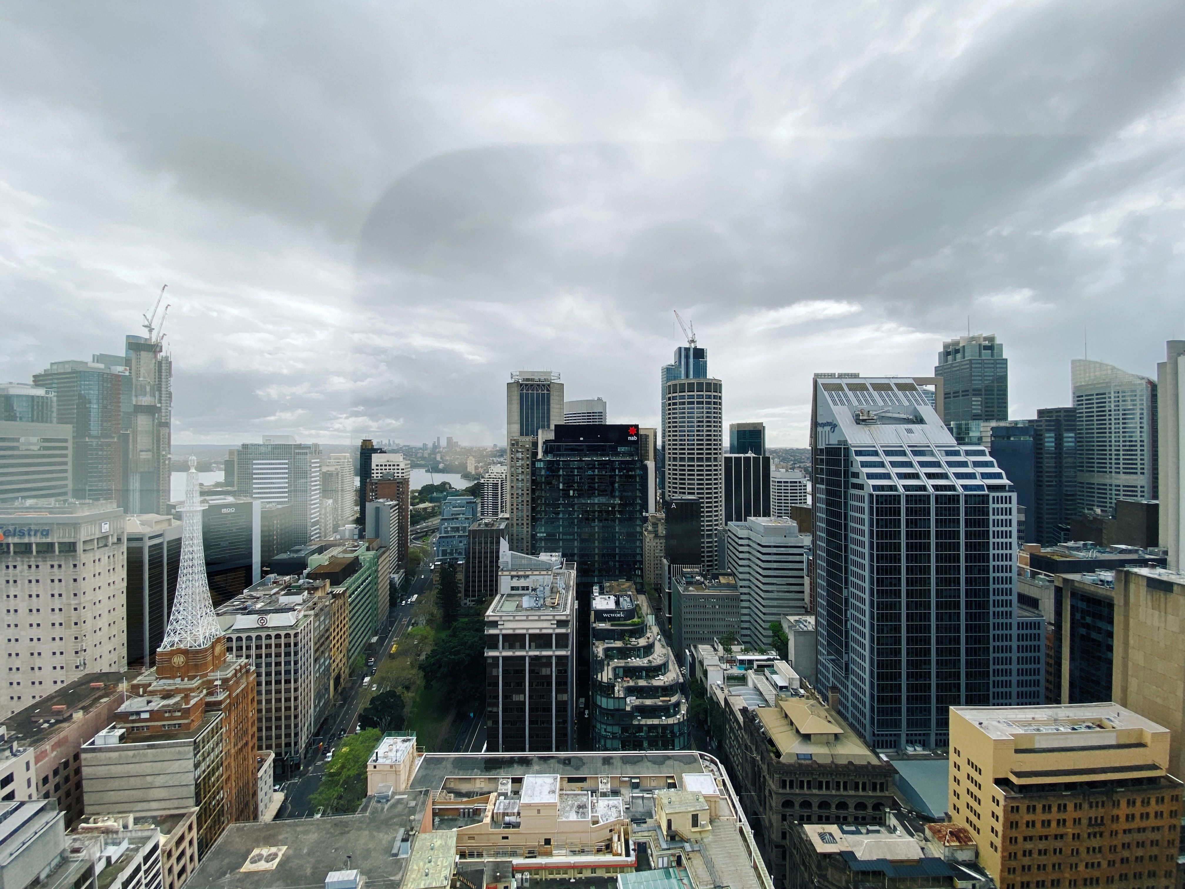 A photo looking out over Sydney CBD from the 30th floor of our office. Lots of tall buildings, and it's all cloudy and miserable-looking.