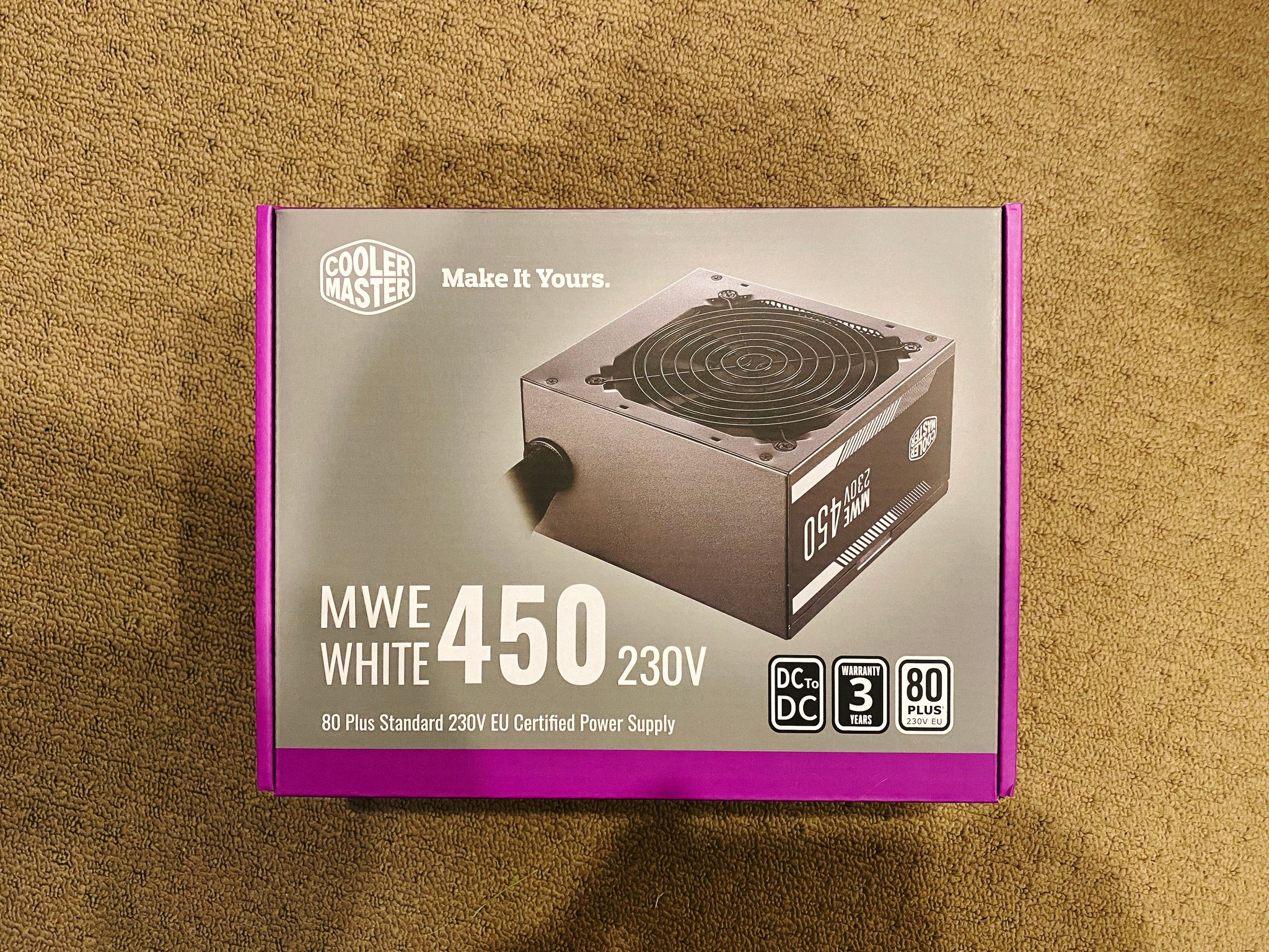 A photo of the box of a 450W CoolerMaster power supply.