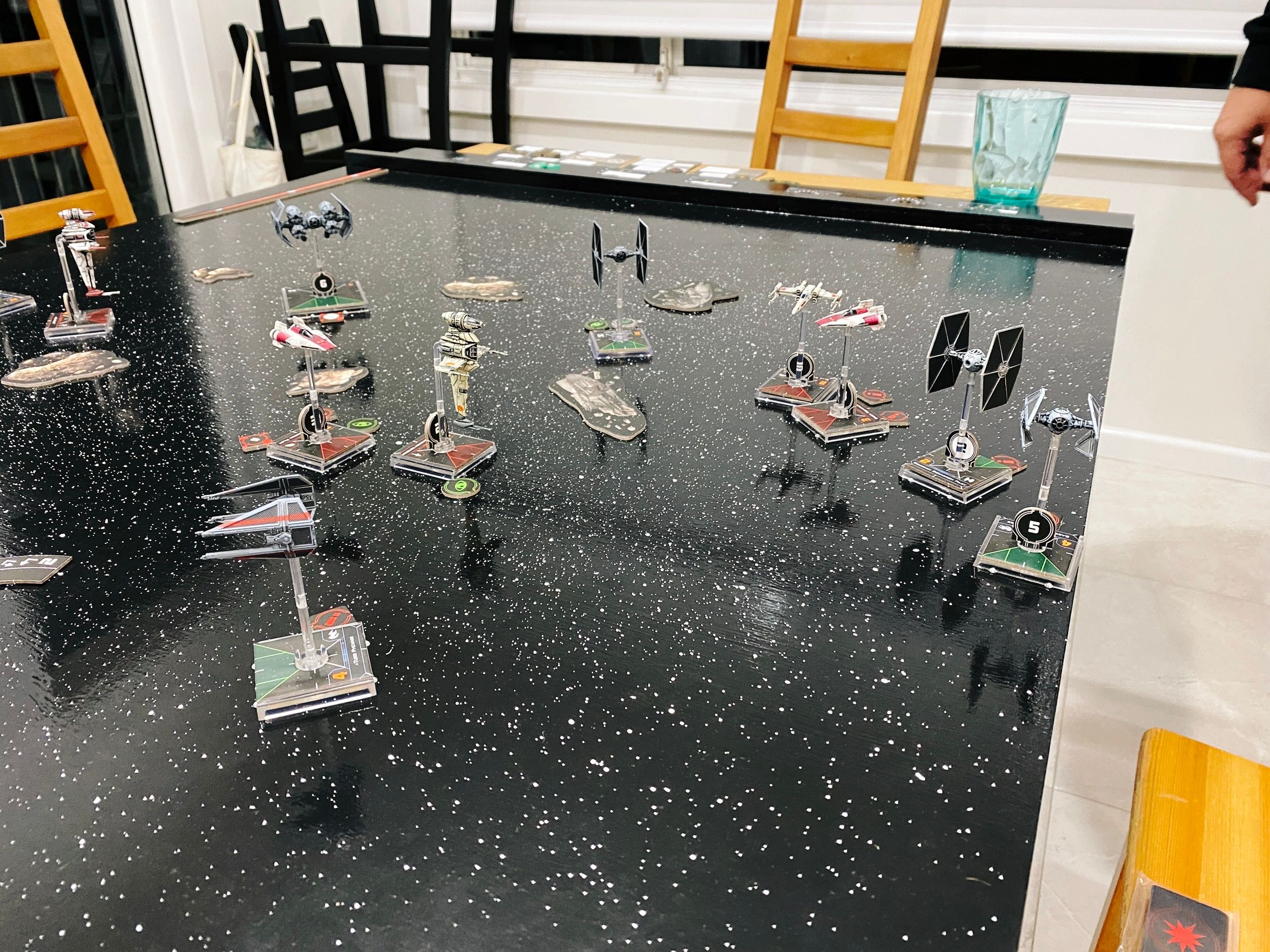 A photo mid-game close-up with a bunch of the ships all close together facing every which way.