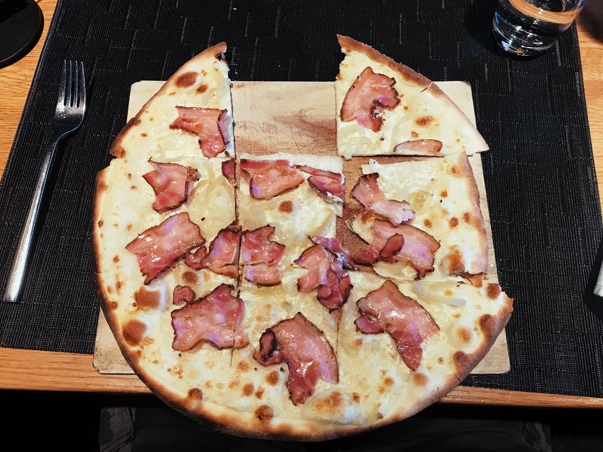 Flammenkuchen, a German dish similar to pizza but without cheese. This one is traditional and has onions and bacon.
