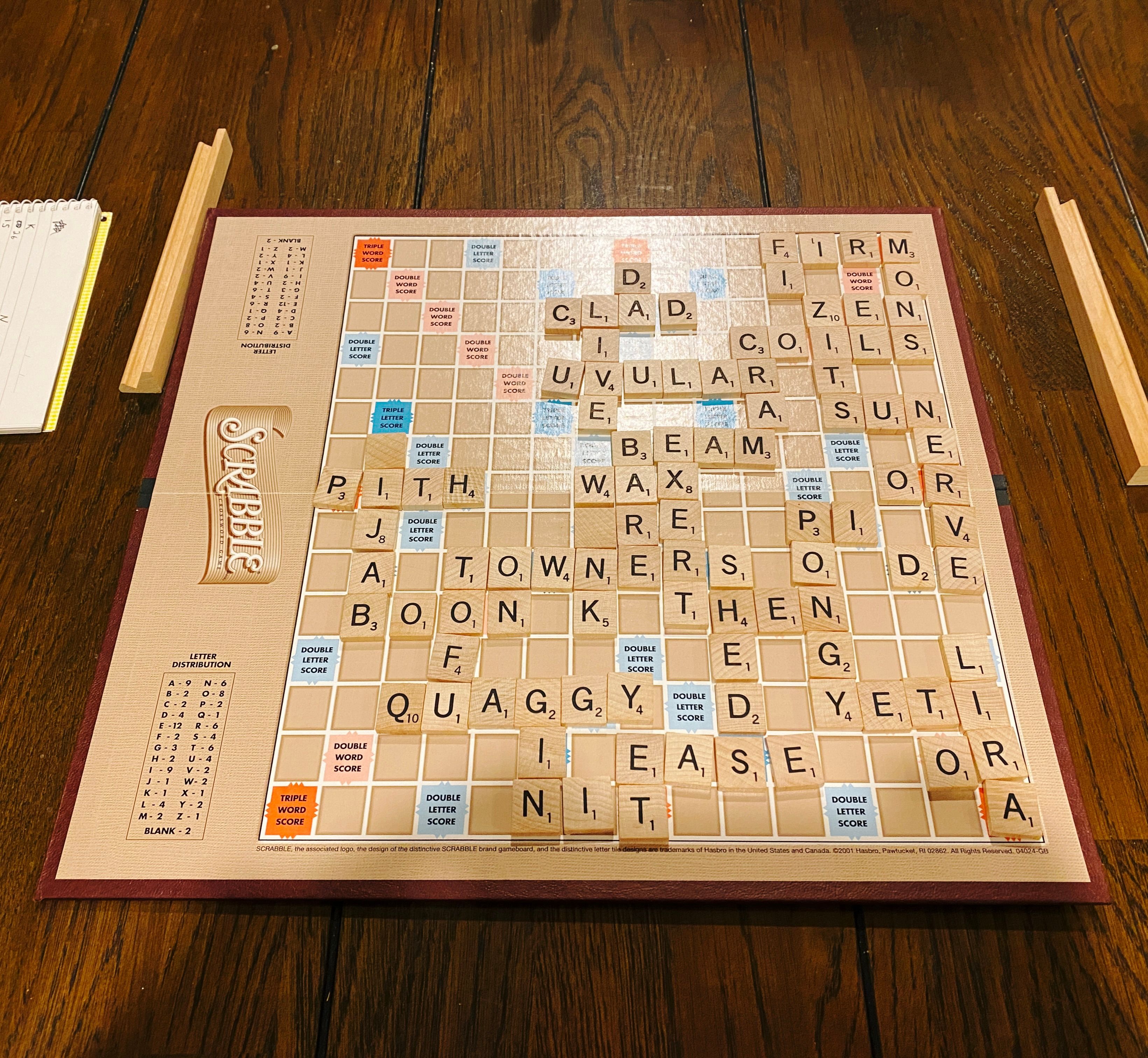 A photo of the end game state of a Scrabble board.