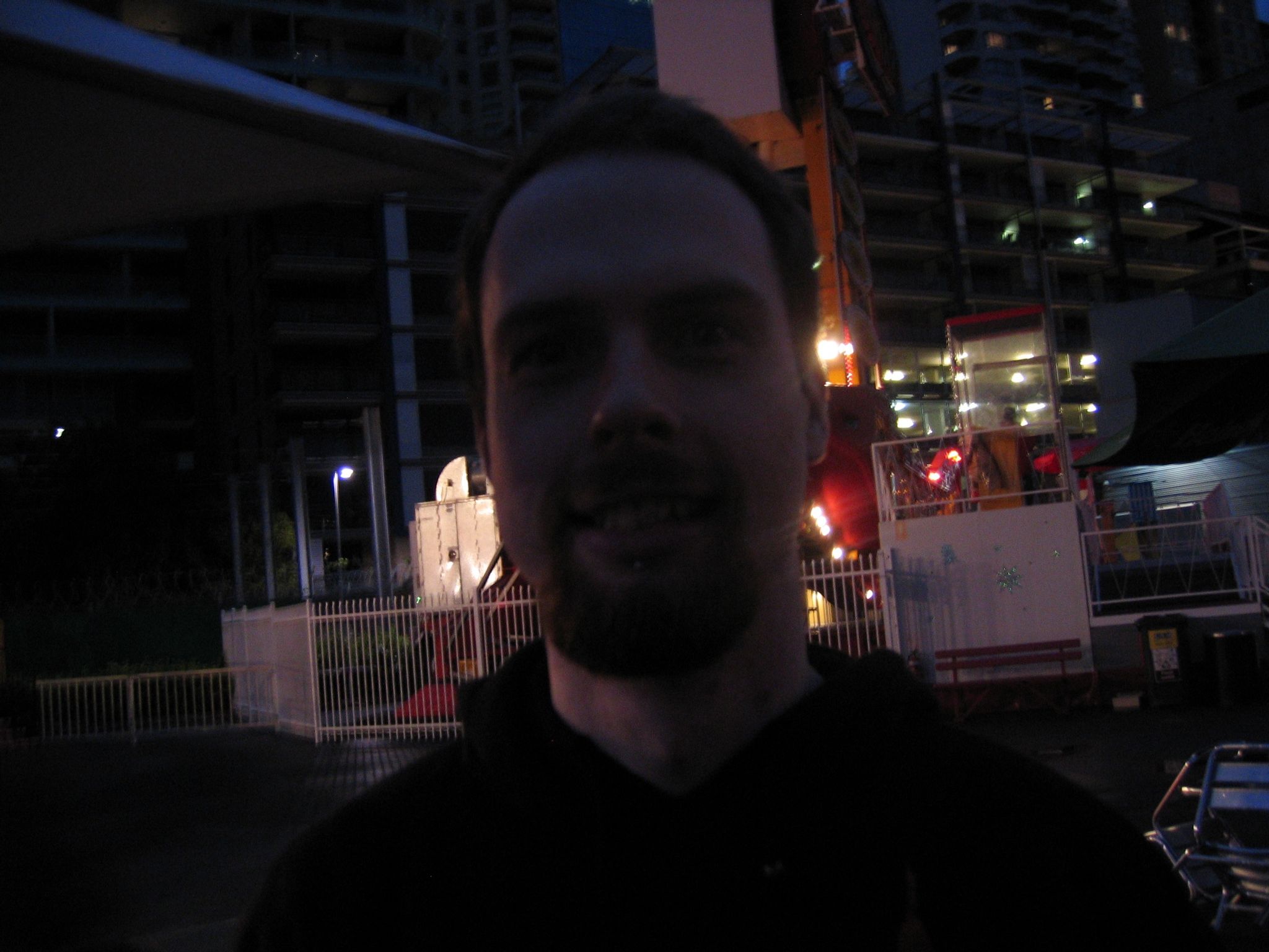 A VERY dimly-lit photo of me, a white man with short brown hair and a goatee.