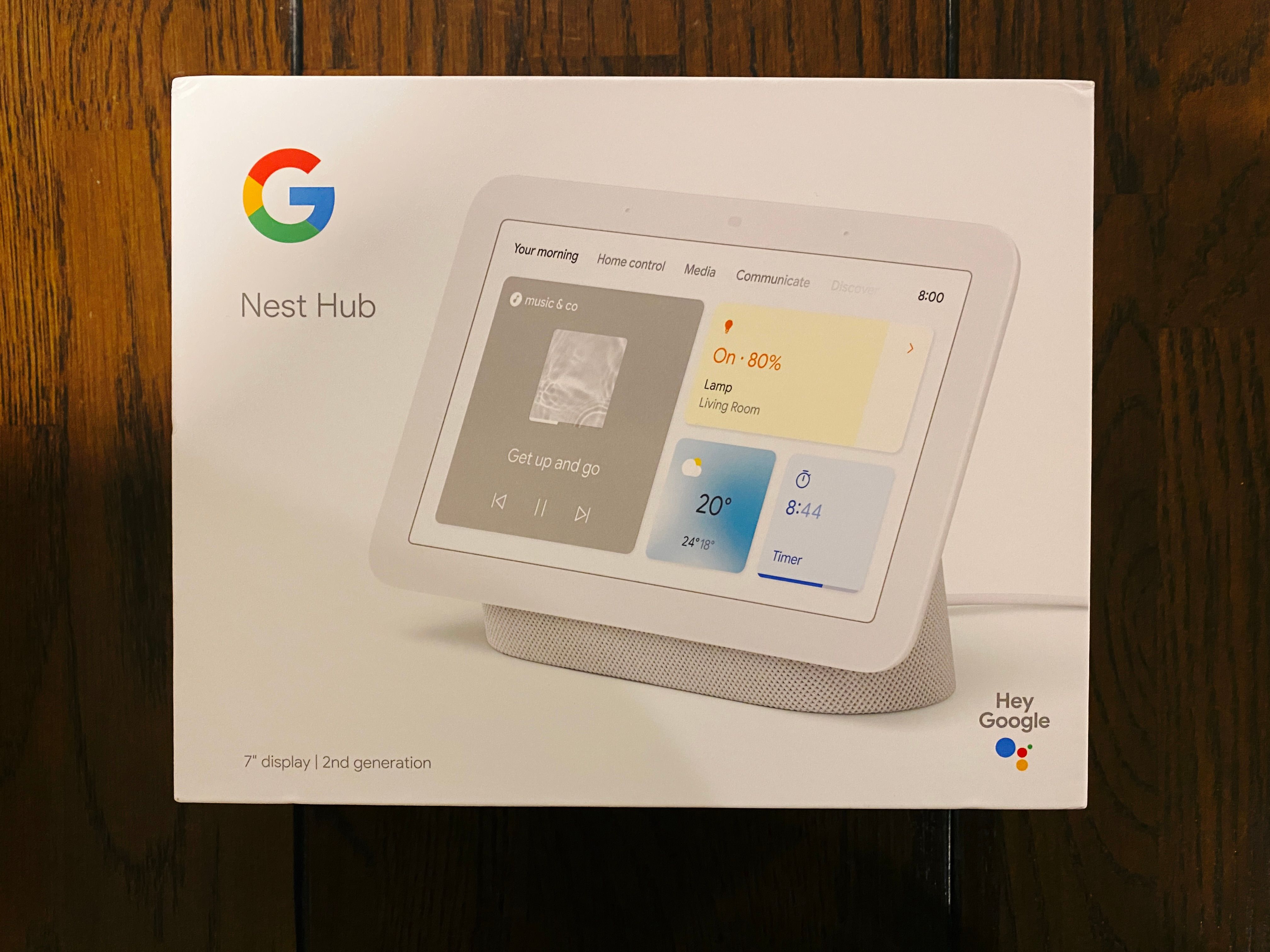 A photo of the box of a Google Nest Hub. It's a white device with a maybe 7"-ish display at an angle attached to a wide base.